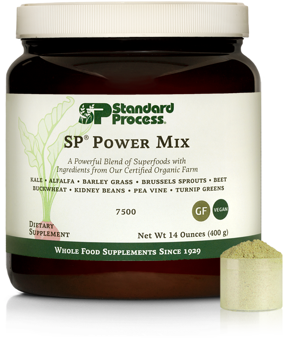 Tub of SP Power Mix next to a scoop of the green powder.