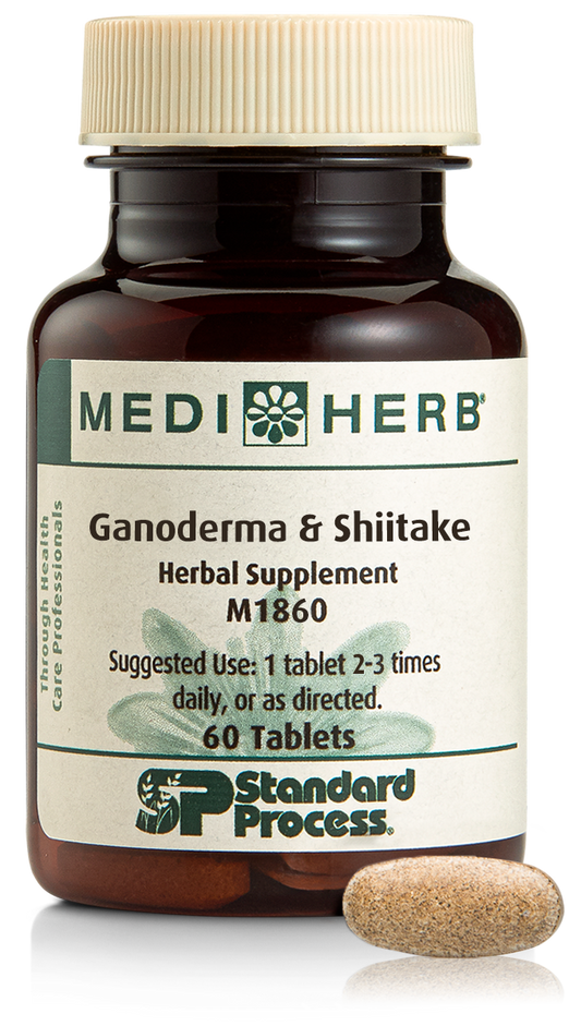 A bottle of Ganoderma & Shiitake herbal supplement next to a tablet.